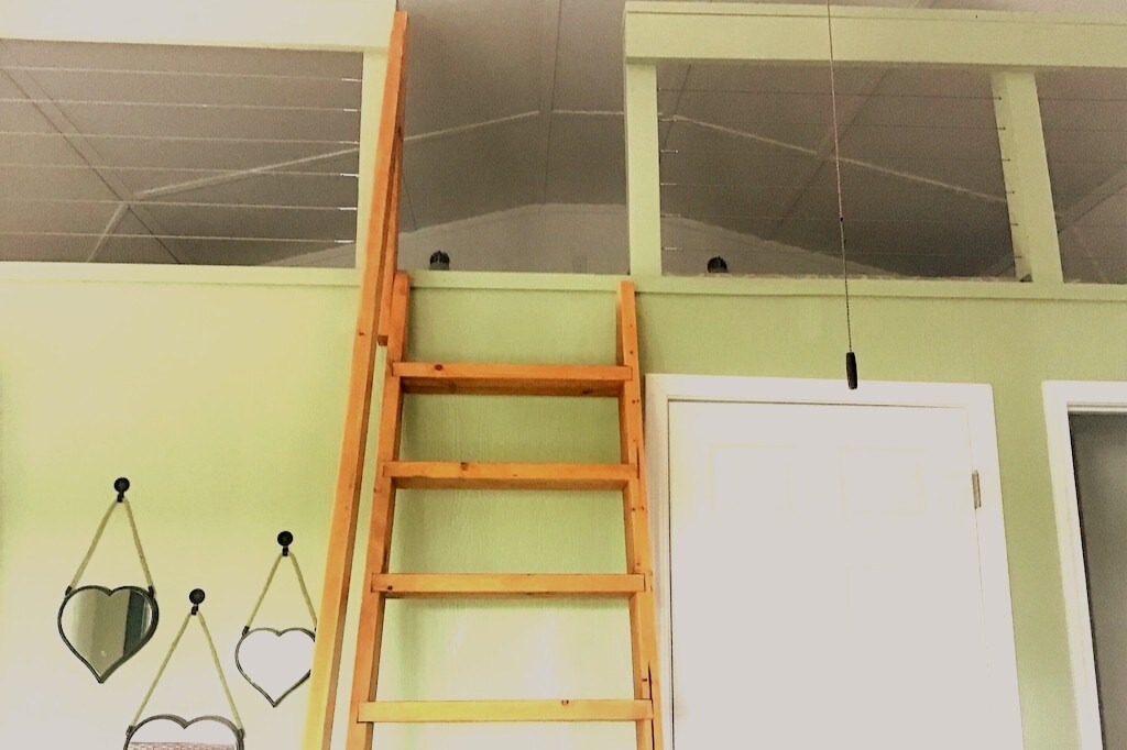 Ladder leading to beds upstairs.