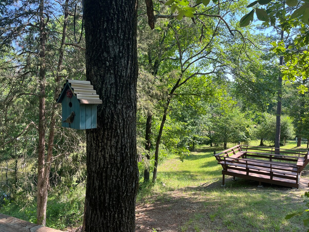Shared deck and firepit for all cabins.