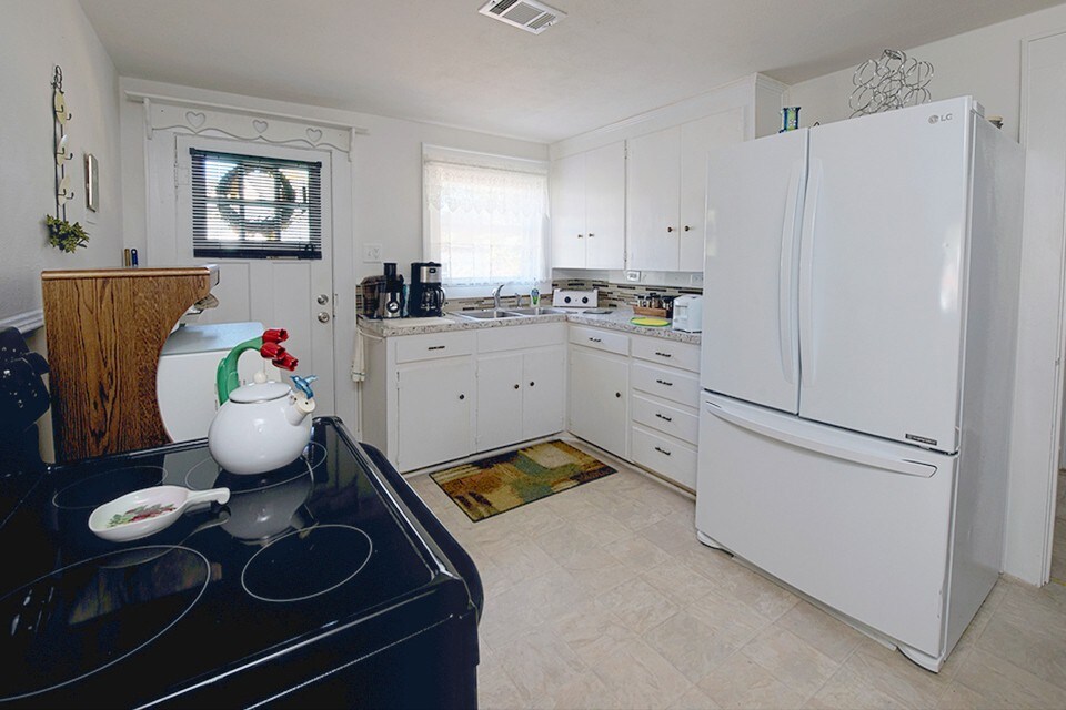 Cozy Kitchen has everything you need to cook & serve meals- including a jug of water from the downtown hot springs !