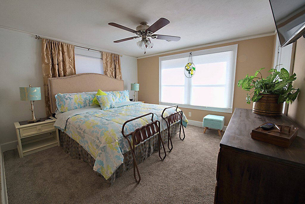 Comfy Pillow Top King Size Bed. Luggage Racks for your suitcases so they don't mark the bedspread.