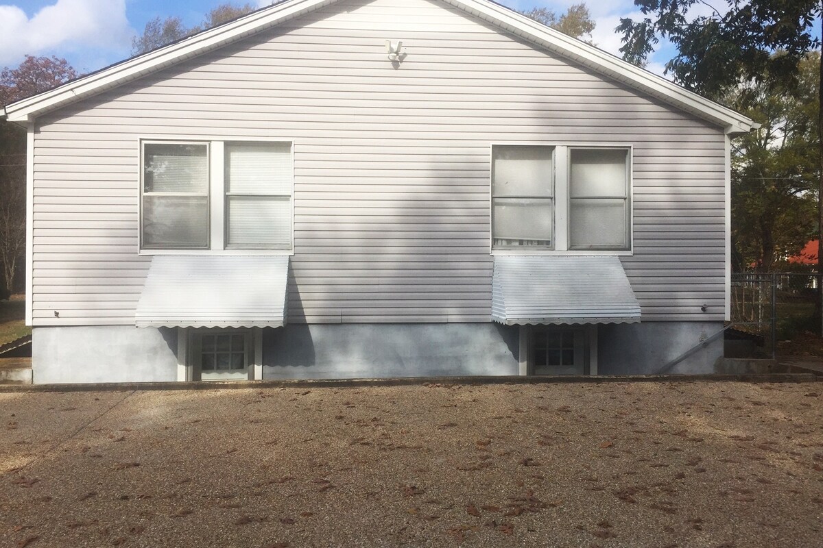 Motion Night Lit Parking off the rear alley. This unit is on the right side, with a gated side yard.
